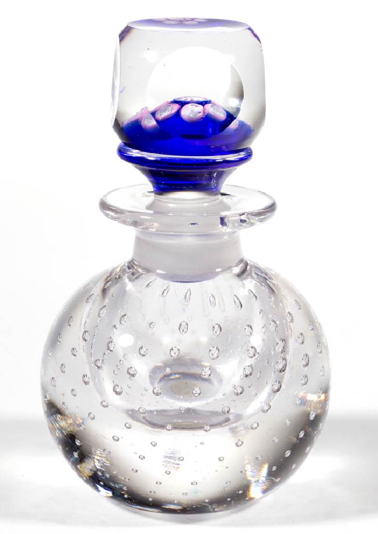 PAIRPOINT CONTROLLED-BUBBLE PAPERWEIGHT PERFUME BOTTLE: PAIRPOINT CONTROLLED-BUBBLE PAPERWEIGHT PERFUME BOTTLE, colorless, spherical base, topped with a cut-faceted stopper with a central rose cane with an outer band of matching rose canes, all above a blu