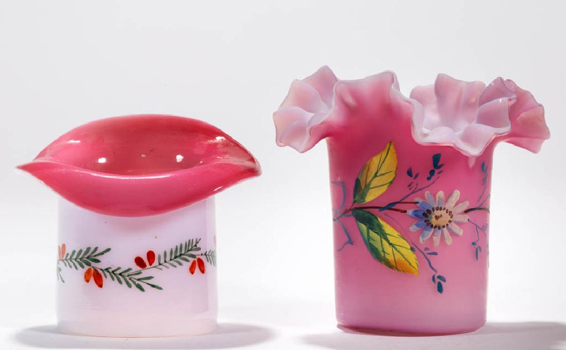 VICTORIAN CASED GLASS TOOTHPICK HOLDERS, LOT OF TWO: VICTORIAN CASED GLASS TOOTHPICK HOLDERS, LOT OF TWO, comprising an opal-cased rose example with polychrome-enamel floral decoration, crimped and ruffled rim, and plush finish, and a rose-cased opal ha