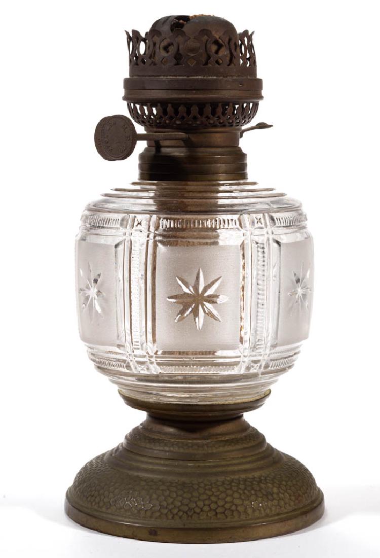 DUNCAN NO. 90 / ZIPPERED BLOCK KEROSENE VASE LAMP: DUNCAN NO. 90 / ZIPPERED BLOCK KEROSENE VASE LAMP, frosted and colorless, ovoid font with frosted panels, metal base with hand-beaten-type decoration, period No. 3 collar. Fitted with a "M.B.CO." dupl