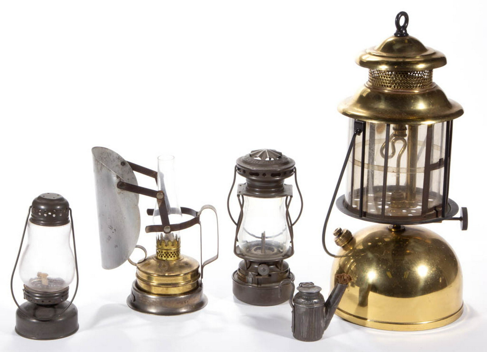 ASSORTED BRASS AND METAL LIGHTING DEVICES, LOT OF FIVE: ASSORTED BRASS AND METAL LIGHTING DEVICES, LOT OF FIVE, comprising a skater's lantern, a "DIETZ SCOUT" diminutive lantern, and a vapor lantern with mica shade. Various makers. 19th and 20th century. 2