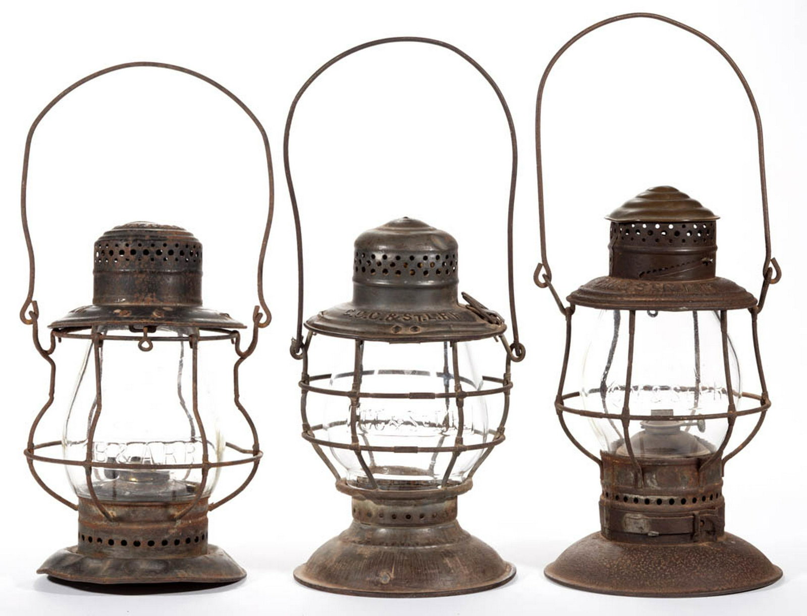 ASSORTED SHEET-IRON NAME EMBOSSED RAILROAD LANTERN AND: ASSORTED SHEET-IRON NAME EMBOSSED RAILROAD LANTERN AND GLOBE, LOT OF THREE, comprising an Adlake & Westlake example with brass cap and bayonet catch bottom shoulder embossed "C. M & ST P. R. R."; a Ha