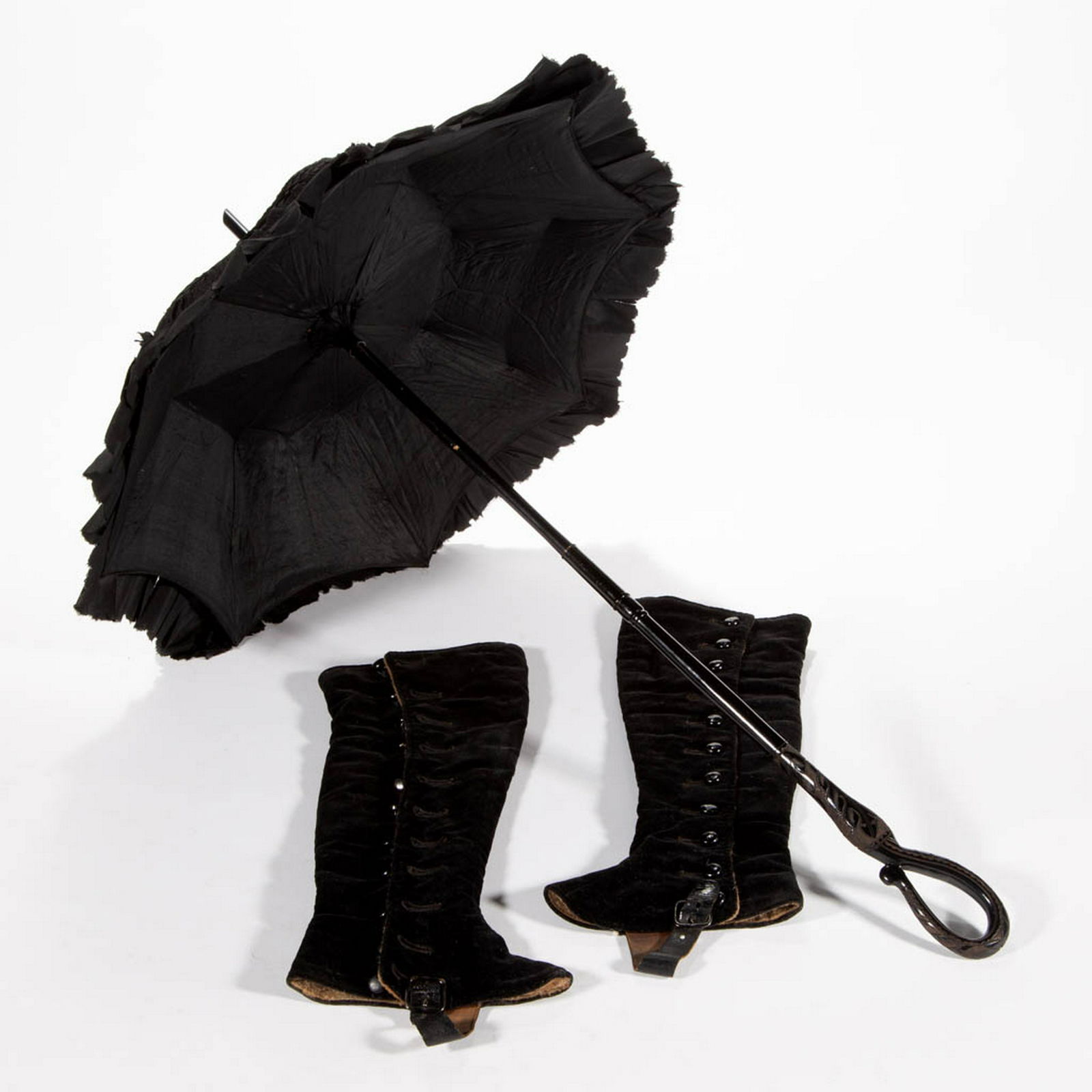 VICTORIAN BLACK PARASOL AND BOOT SPATS, LOT OF THREE: VICTORIAN BLACK PARASOL AND BOOT SPATS, LOT OF THREE PIECES, each for a child or young lady, comprising a pair of tall velvet boot spats/covers having brown fabric interior lining with buttons to the