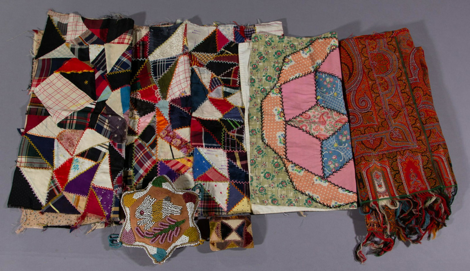 ANTIQUE / VINTAGE TEXTILE ARTICLES, LOT OF SEVEN: ANTIQUE / VINTAGE TEXTILE ARTICLES, LOT OF SEVEN, (updated 8/22/19) comprising a large Native American beaded pin cushion having a six-point star form featuring a rabbit to the center, a crazy quilt-t