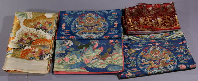 CHINESE / JAPANESE TEXTILES, LOT OF FIVE: CHINESE / JAPANESE TEXTILES, LOT OF FIVE, comprising a set of three blue pieces with colorful woven designs, hand-drawn detailing, and pink fabric lining featuring a 36 1/2" x 40" OA skirt or panel wi