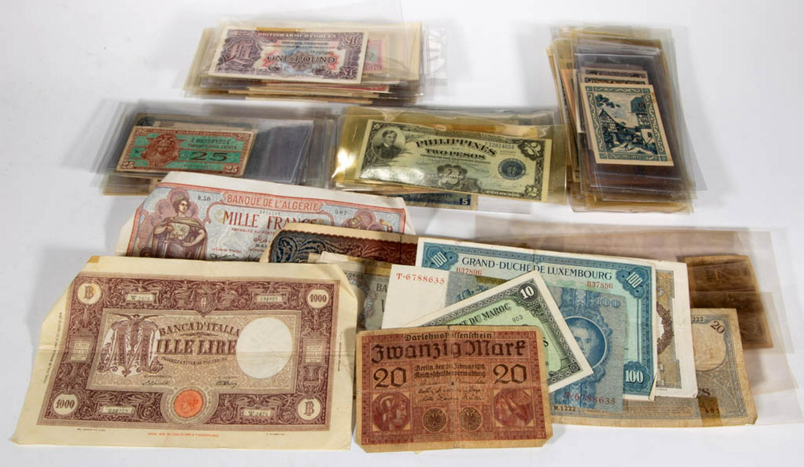 ASSORTED FOREIGN AND US MILITARY CURRENCY, UNCOUNTED: ASSORTED FOREIGN AND US MILITARY CURRENCY, UNCOUNTED LOT, including US Military Payment Certificates, British Armed Forces, France, Germany, Switzerland, Argentina, Brazil, Philippines, Korea, Japan, 
