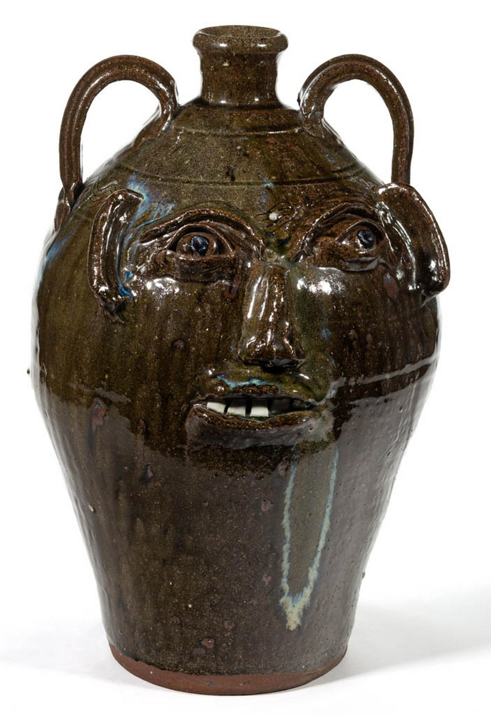 SIGNED "B.B. CRAIG" (1914-2002), VALE, NORTH CAROLINA: SIGNED "B.B. CRAIG" (1914-2002), VALE, NORTH CAROLINA STONEWARE LARGE FACE JUG, alkaline-glazed, featuring one row of four incised sine waves encircling shoulder, molded eyebrows, clay eyes with black