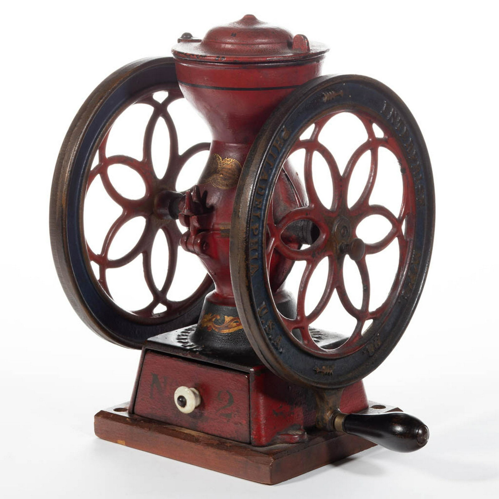 ENTERPRISE NO. 2 CAST-IRON TWO-WHEEL COFFEE MILL /: ENTERPRISE NO. 2 CAST-IRON TWO-WHEEL COFFEE MILL / GRINDER, swivel lid, original wooden base, paint, and decals. Enterprise Mfg. Co., Philadelphia, PA. Fourth quarter 19th century. 12 1/2" HOA, 8 3/4"