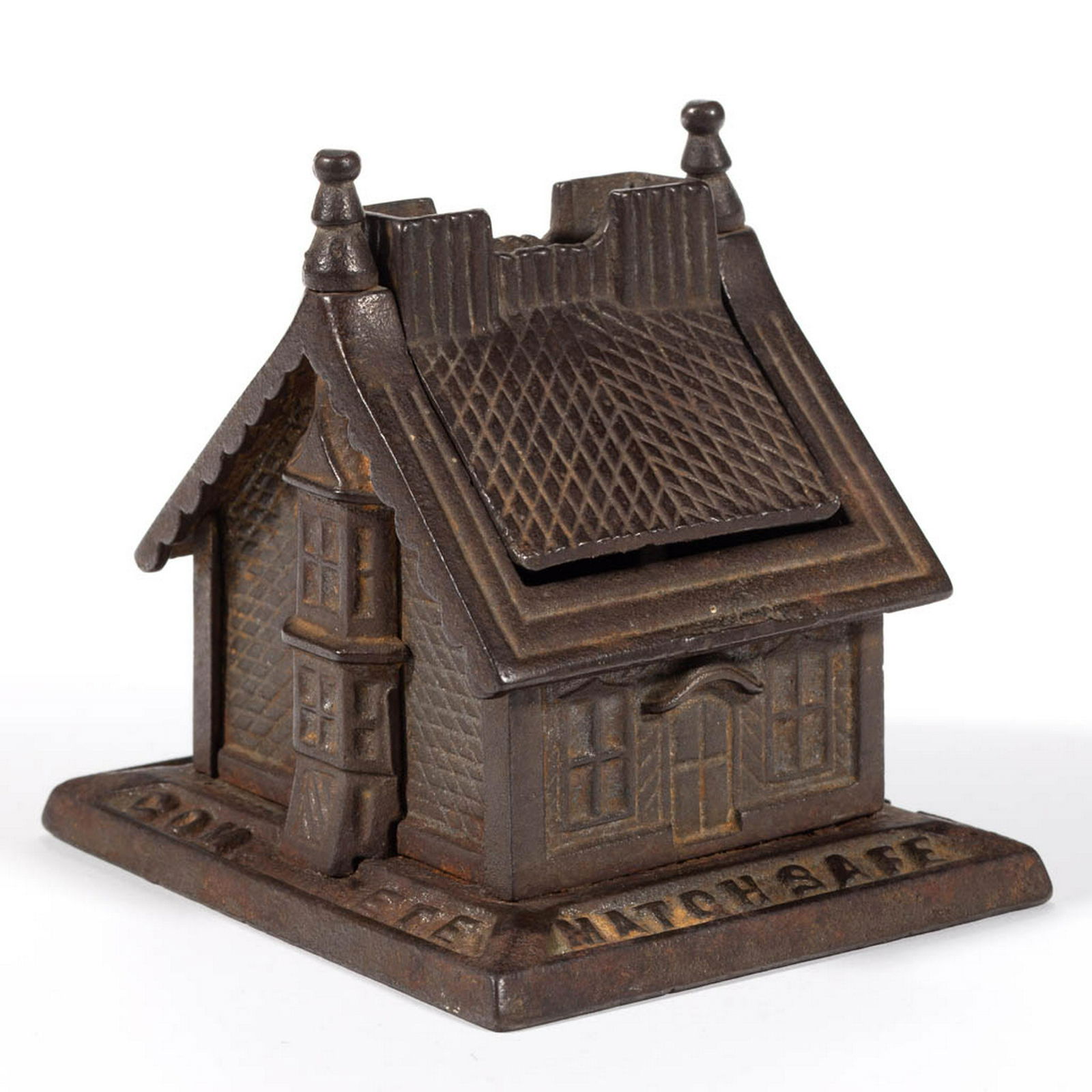 FIGURAL COTTAGE CAST-IRON MATCH SAFE: FIGURAL COTTAGE CAST-IRON MATCH SAFE, separate roof with striker swings to allow access to two interior compartments, embossed "COMPLETE / MATCH SAFE / PATD JULY / 13, 1883" around base. Circa 1885. 4