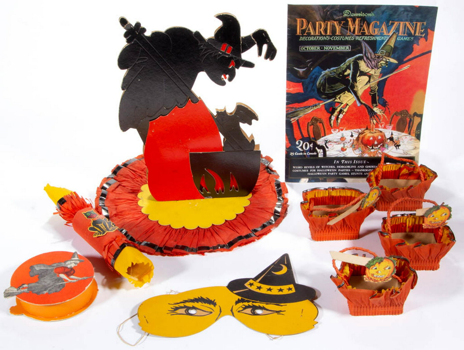 VINTAGE AND OTHER HALLOWEEN ARTICLES, LOT OF EIGHT: VINTAGE AND OTHER HALLOWEEN ARTICLES, LOT OF EIGHT, comprising a cardboard witch table decoration with crepe paper around base, a set of four miniature crepe paper baskets with three having jack-o-lan