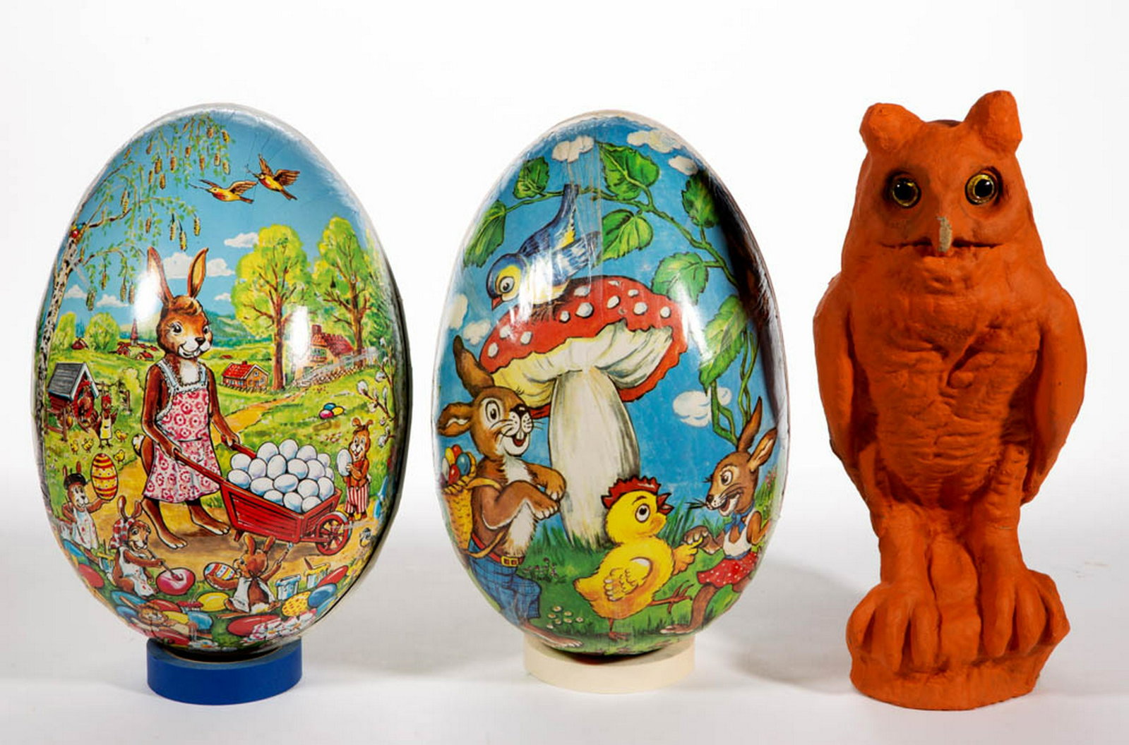 LARGE CARDBOARD AND PAPIER-MACHE ARTICLES, LOT OF THREE: LARGE CARDBOARD AND PAPIER-MACHE ARTICLES, LOT OF THREE, comprising two large cardboard Easter egg candy containers with printed exteriors having colorful scenes featuring rabbits, and a papier-mache 