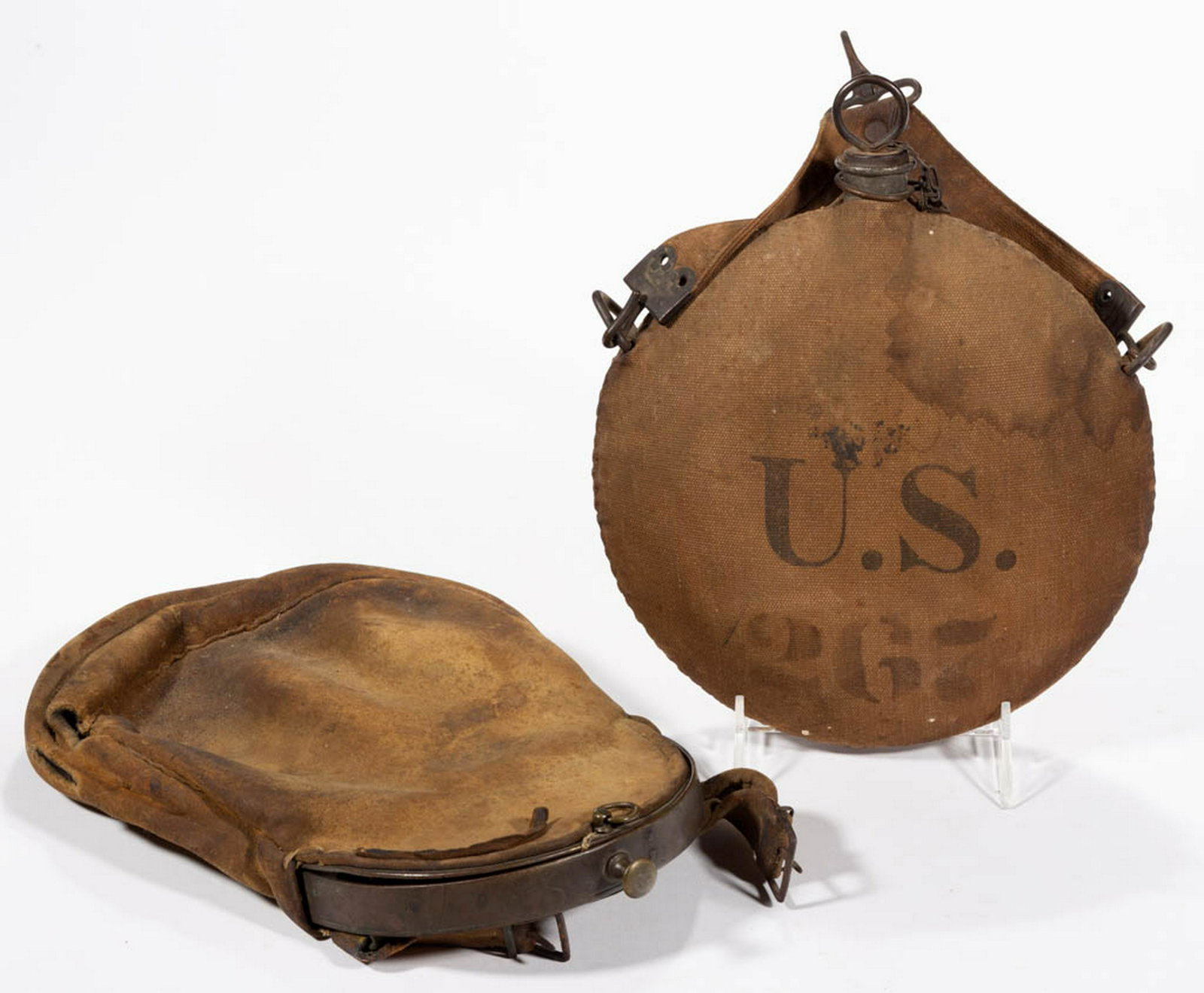UNITED STATES INDIAN WARS CANTEEN: UNITED STATES INDIAN WARS CANTEEN, canvas covered canteen, stamped "U.S." marked and numbered "267" with cavalry canteen strap for mounting on saddle. Together with leather pouch. Two pieces total. Fo