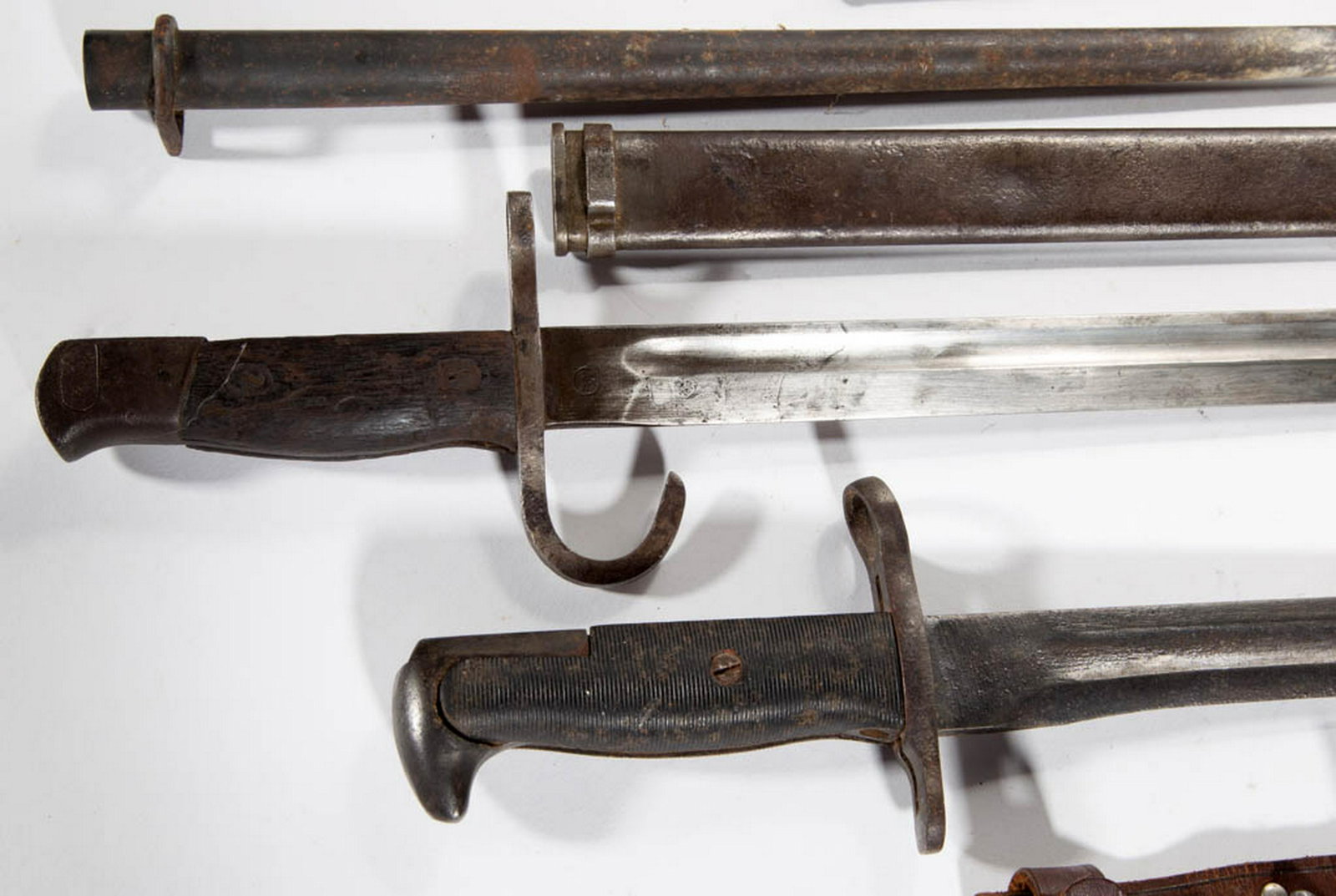 WORLD WAR TWO / WWII ERA BAYONETS, LOT OF TWO: WORLD WAR TWO / WWII ERA BAYONETS, LOT OF TWO, comprising a Japanese Type 30 bayonet with scabbard, and stamped markings on tang for the Mulkden arsenal, and a US M1 Garande bayonet, possibly made in 