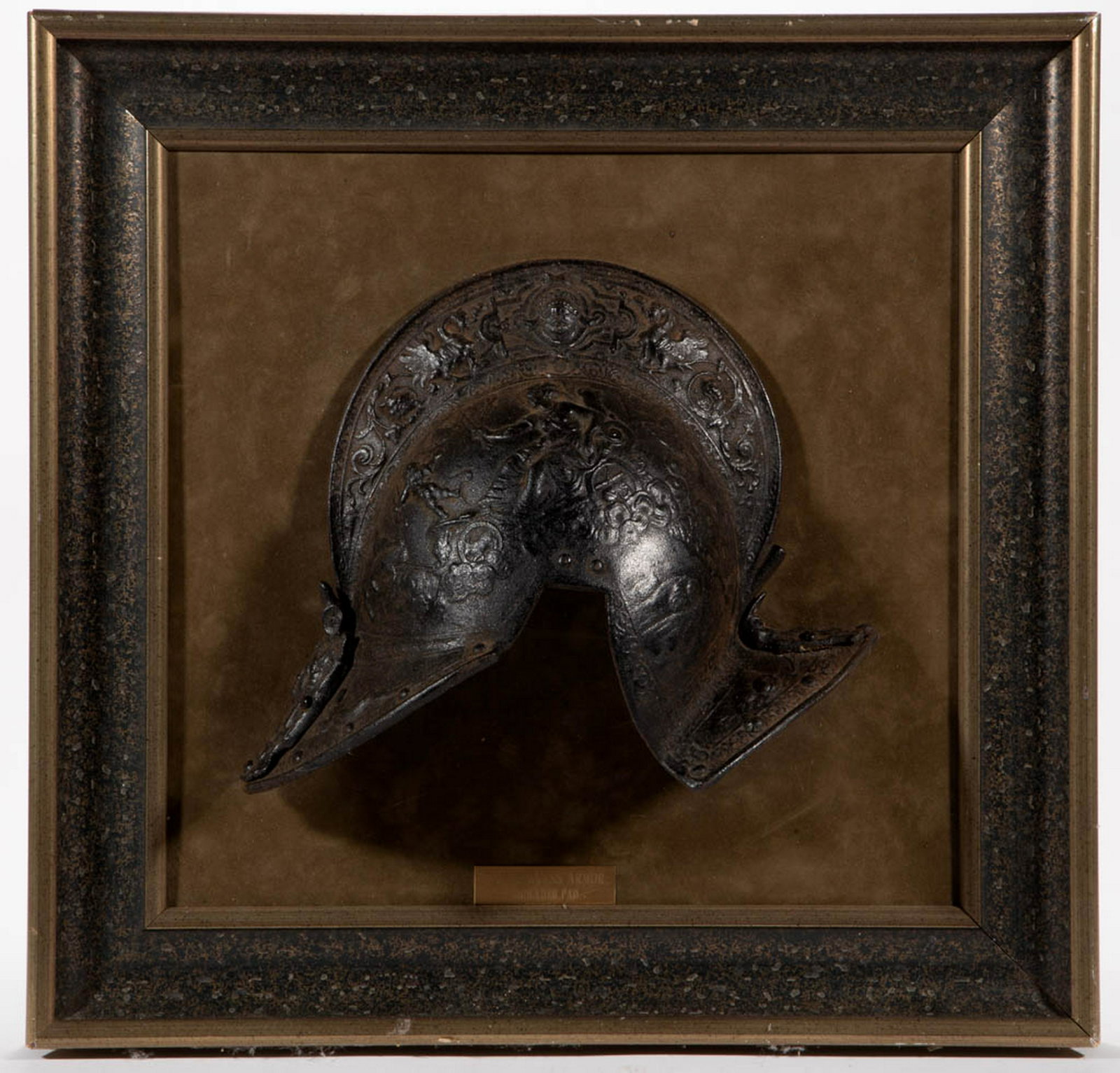 CLASSICAL ROMAN STYLE IRON ARMOR: CLASSICAL ROMAN STYLE IRON ARMOR, possibly a pauldron, with embossed decor featuring Cupid and other Roman deities,_x000D_ gallery tag states "ROMAN DRESS ARMOR / SHOULDER PAD". Late 19th/early 20th c