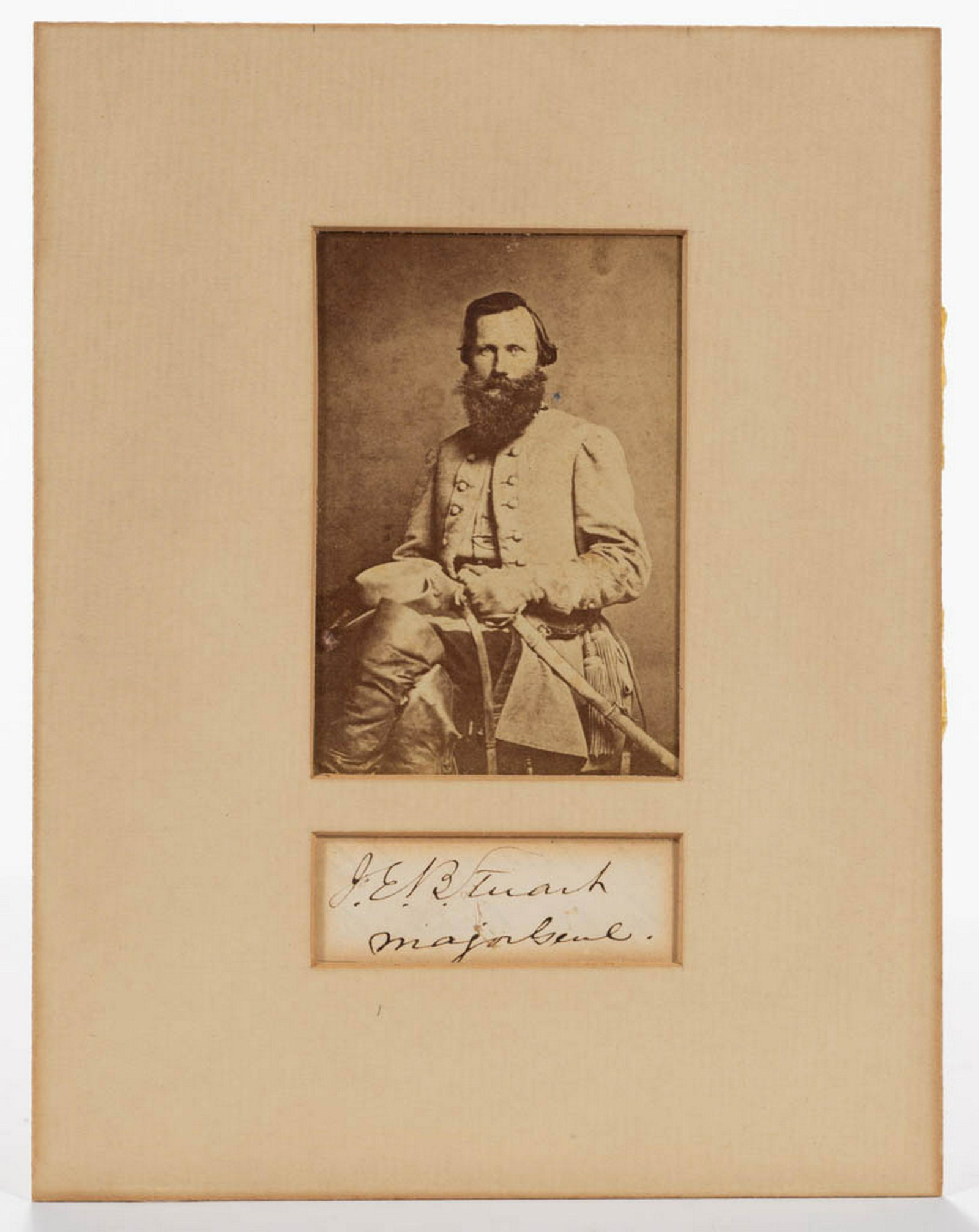 CIVIL WAR CONFEDERATE JAMES EWELL BROWN "JEB" STUART: CIVIL WAR CONFEDERATE JAMES EWELL BROWN "JEB" STUART (1833-1864) CDV AND AUTOGRAPH, depicting Major-General Stuart seated in full uniform holding his saber and hat, backstamped for Bendann Bros., Balt