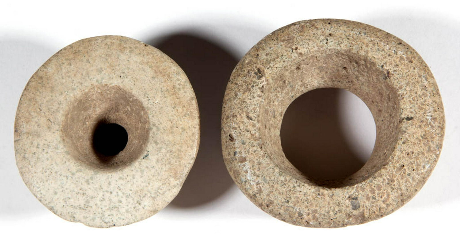 MAYAN-ATTRIBUTED STONE ARTIFACTS, LOT OF TWO: MAYAN-ATTRIBUTED STONE ARTIFACTS, LOT OF TWO, possibly weaving spindle weights, probably from Guatemala. 2 1/4" and 2 1/2" DOA. Excellent as-found condition with expected wear. Provenance: Private col