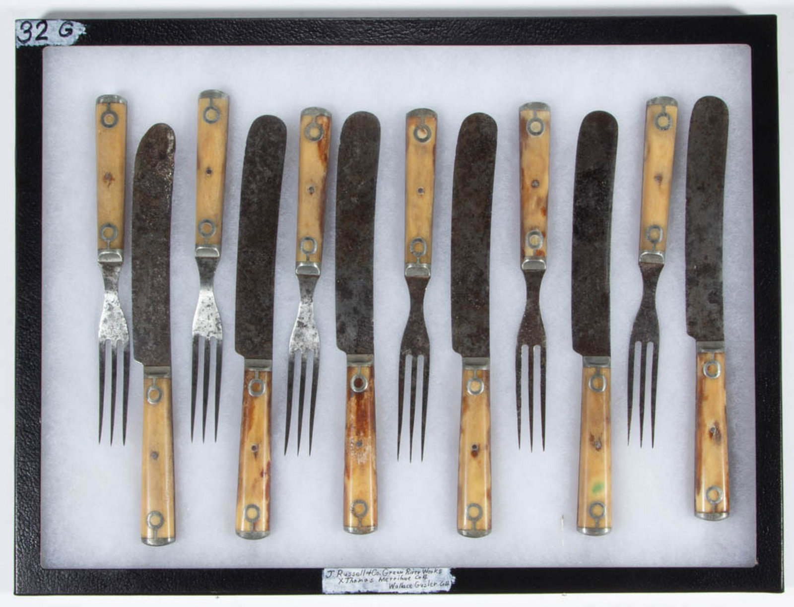 AMERICAN J. RUSSELL & CO. CUTLERY, SET OF 12: AMERICAN J. RUSSELL & CO. CUTLERY, SET OF 12, comprising six three-tine forks and six blunt-tipped knives, all with bone handles with pewter inlay. Each knife with impressed "J. RUSSELL & CO. / GREEN 