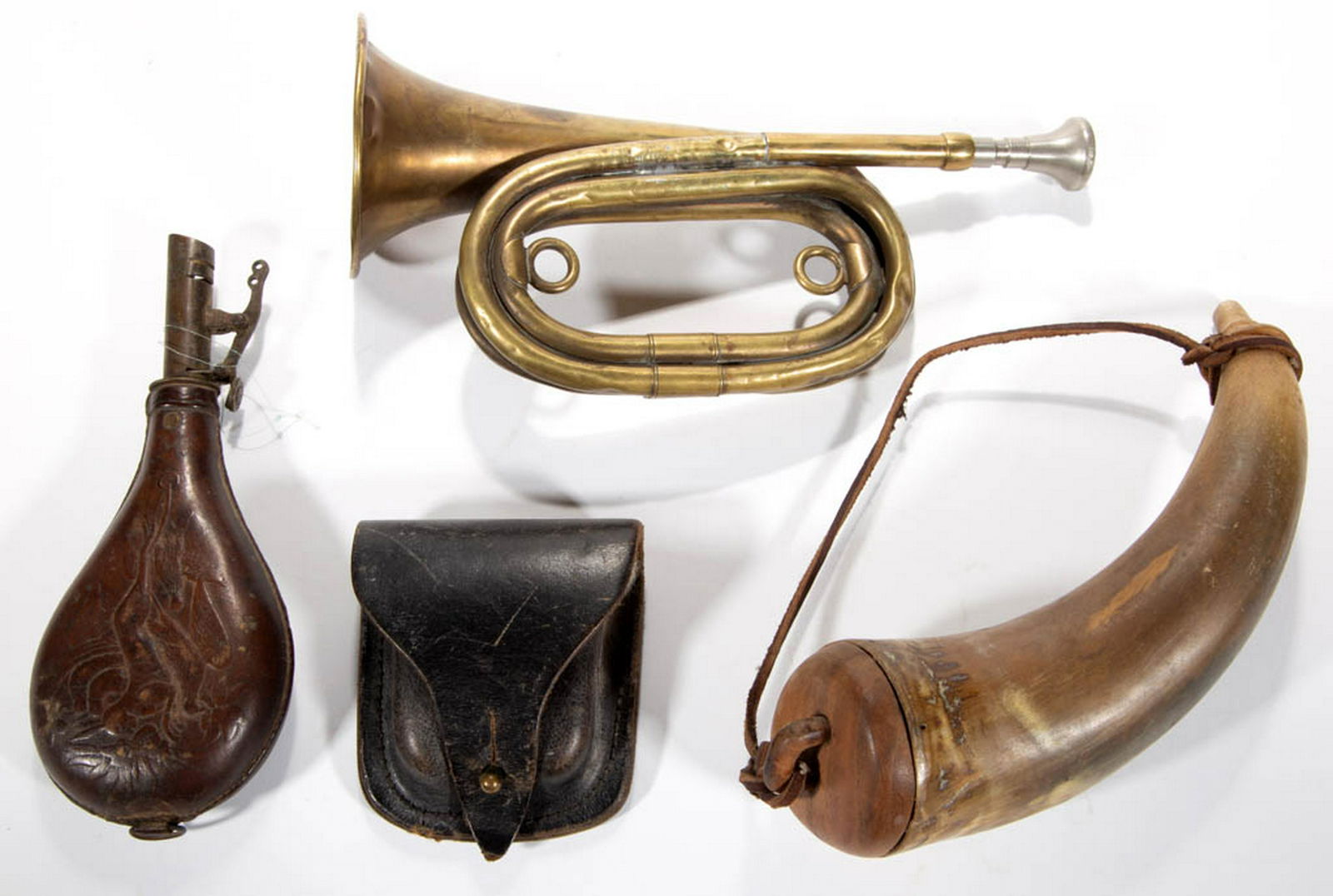 ASSORTED MILITARY / FIREARMS ACCOUTREMENTS, LOT OF FOUR: ASSORTED MILITARY / FIREARMS ACCOUTREMENTS, LOT OF FOUR, comprising a powder horn, leather shot pouch embossed with dead game, a brass bugle marked for J. W. York & Sons, and a leather cap pouch. 19th