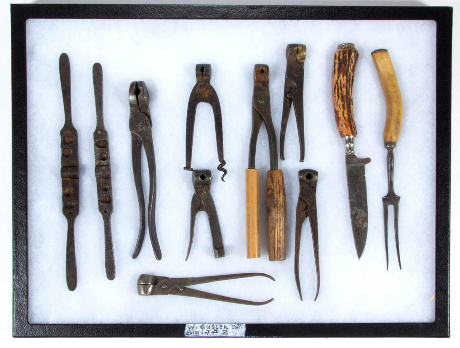 ANTIQUE IRON BULLET / SHOT MOLDS, LOT OF NINE: ANTIQUE IRON BULLET / SHOT MOLDS, LOT OF NINE, each unmarked, including two with mold filled with metal. Together with a two-tined fork and a knife both having stag horn handles, knife with mark for A