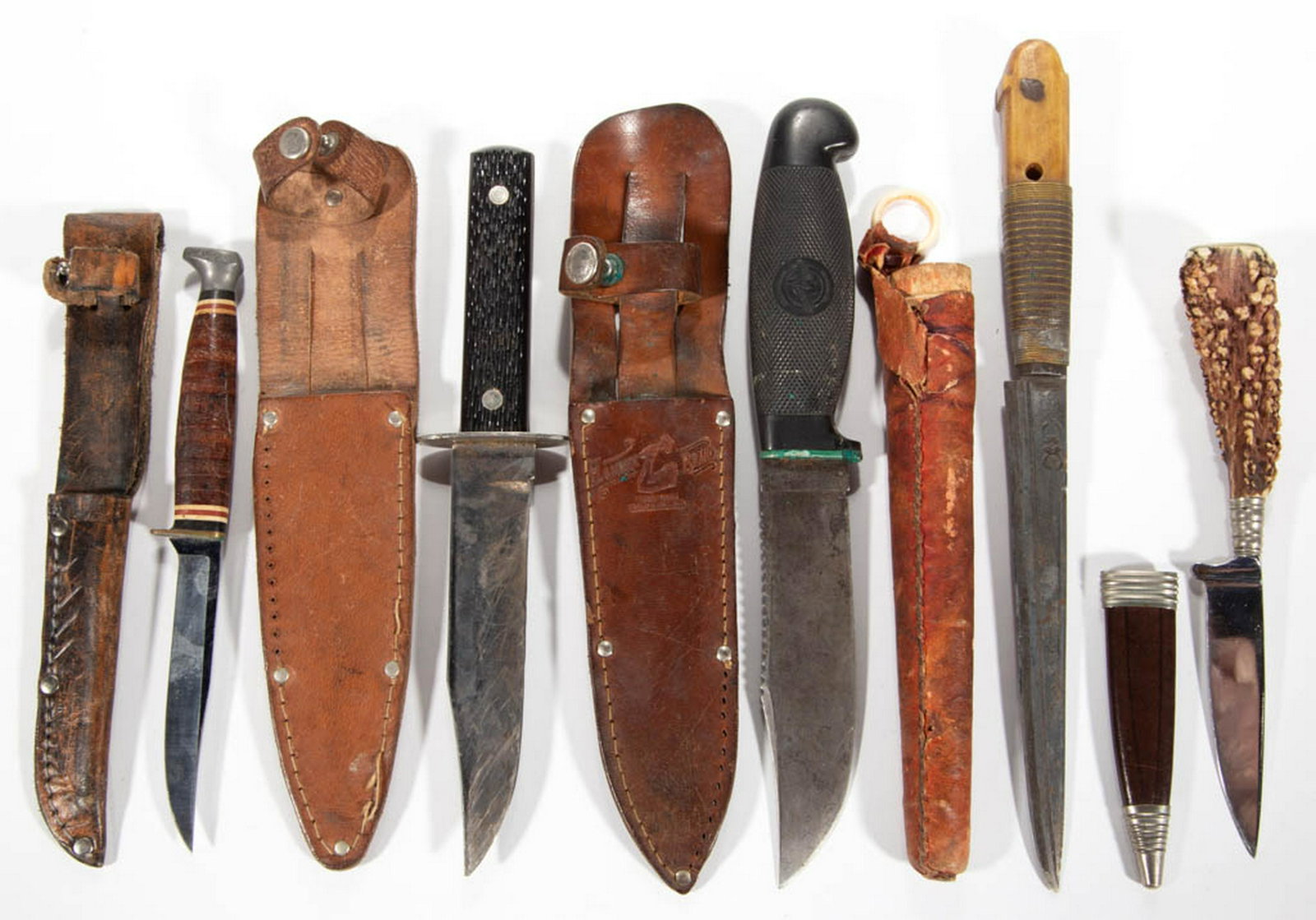 ASSORTED VINTAGE HUNTING AND OTHER KNIVES WITH SHEATHS,: ASSORTED VINTAGE HUNTING AND OTHER KNIVES WITH SHEATHS, LOT OF FIVE, including Kabar 1226 with marked sheath, Hammer Brand with marked sheath, and Rehwappen Solingen with antler handle. 20th century. 
