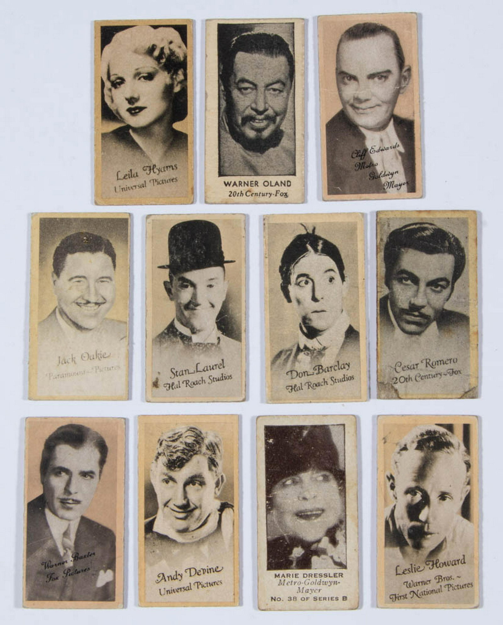 ASSORTED HOLLYWOOD MOVIE STARS VENDING / TRADE CARDS,: ASSORTED HOLLYWOOD MOVIE STARS VENDING / TRADE CARDS, LOT OF 11, comprising Cesar Romero, Stan Laurel, Warner Oland, Leslie Howard, Jack Oakie, Marie Dressler, Don Barclay, Andy Devine, Warner Baxter,