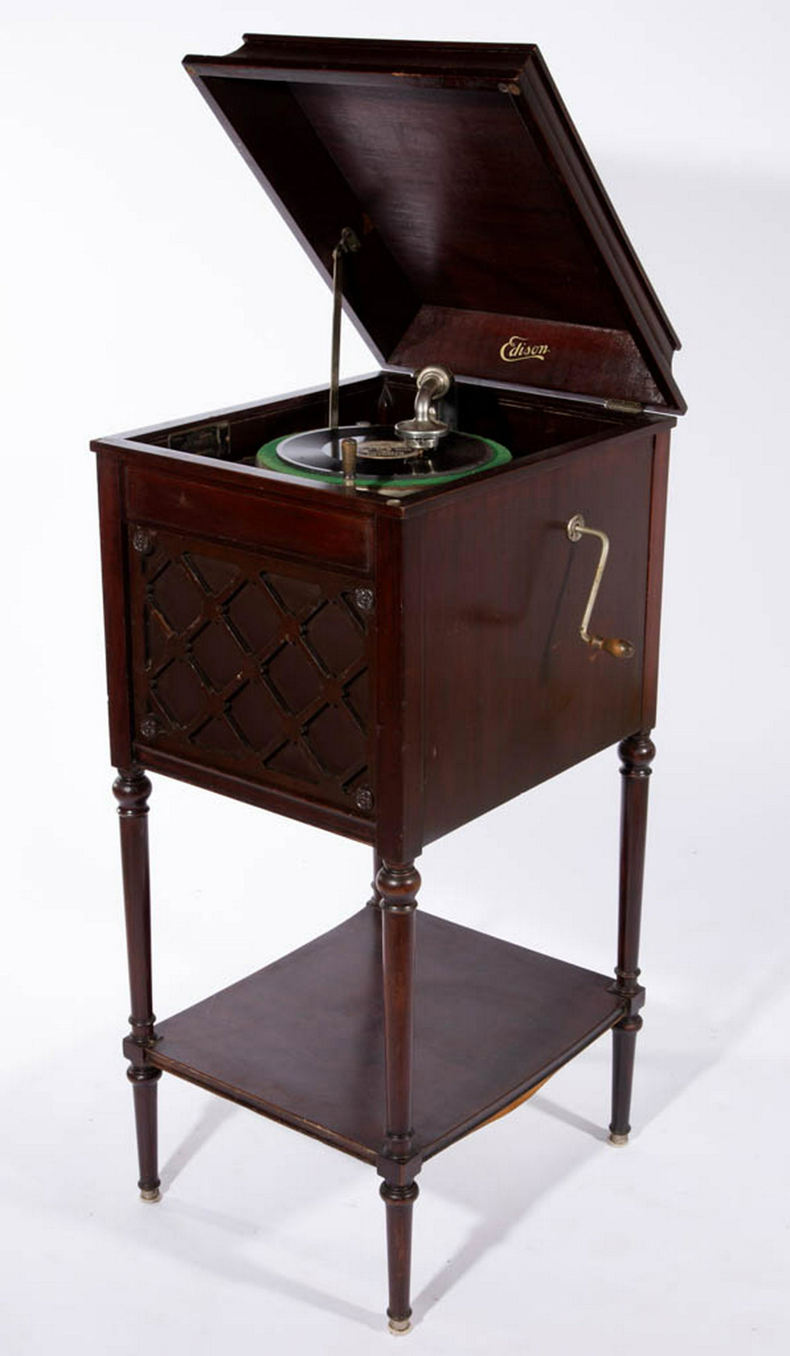EDISON DISC CABINET PHONOGRAPH: EDISON DISC CABINET PHONOGRAPH, Floor Model A100. Retains likely original mahogany finish. Together with phonograph disc. Two pieces total. First quarter 20th century. 43 1/4" H, 18" W, 21" D. Disc wi