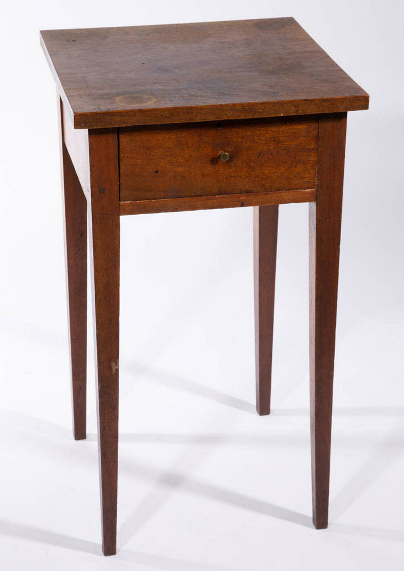 SHENANDOAH VALLEY OF VIRGINIA WALNUT STAND TABLE / LAMP: SHENANDOAH VALLEY OF VIRGINIA WALNUT STAND TABLE / LAMP STAND, square one-board top over a single drawer fitted with likely original lock and small brass knob, raised on tall square-tapered legs. Yell
