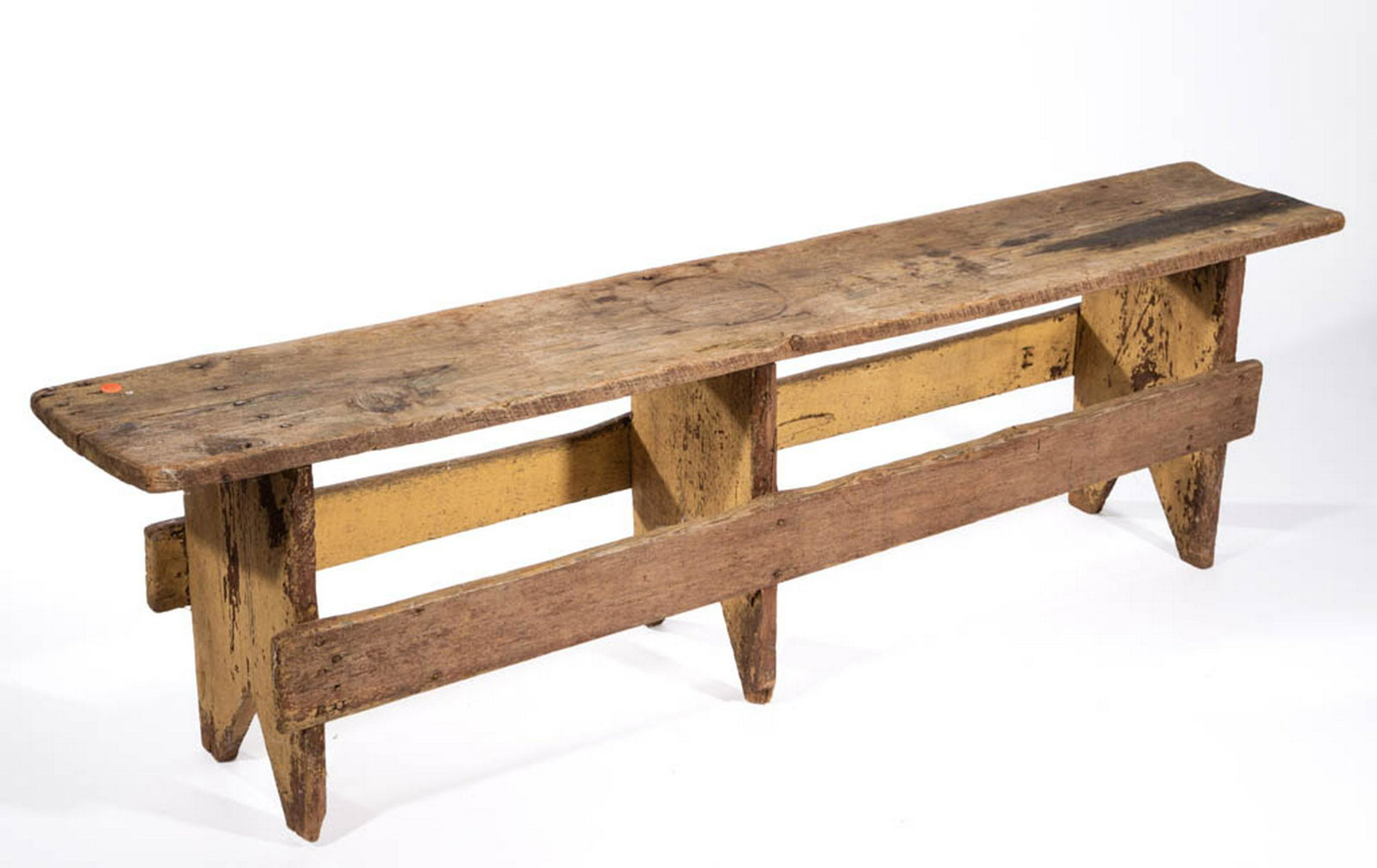 VIRGINIA COUNTRY PAINTED PINE BENCH: VIRGINIA COUNTRY PAINTED PINE BENCH, with cut-outs. Retains an old red- and mustard-painted surface. Discovered in Crozet, VA. 19th century. 16 3/4" H, 60 1/2" W, 10 1/2" D. Good overall condition, mi