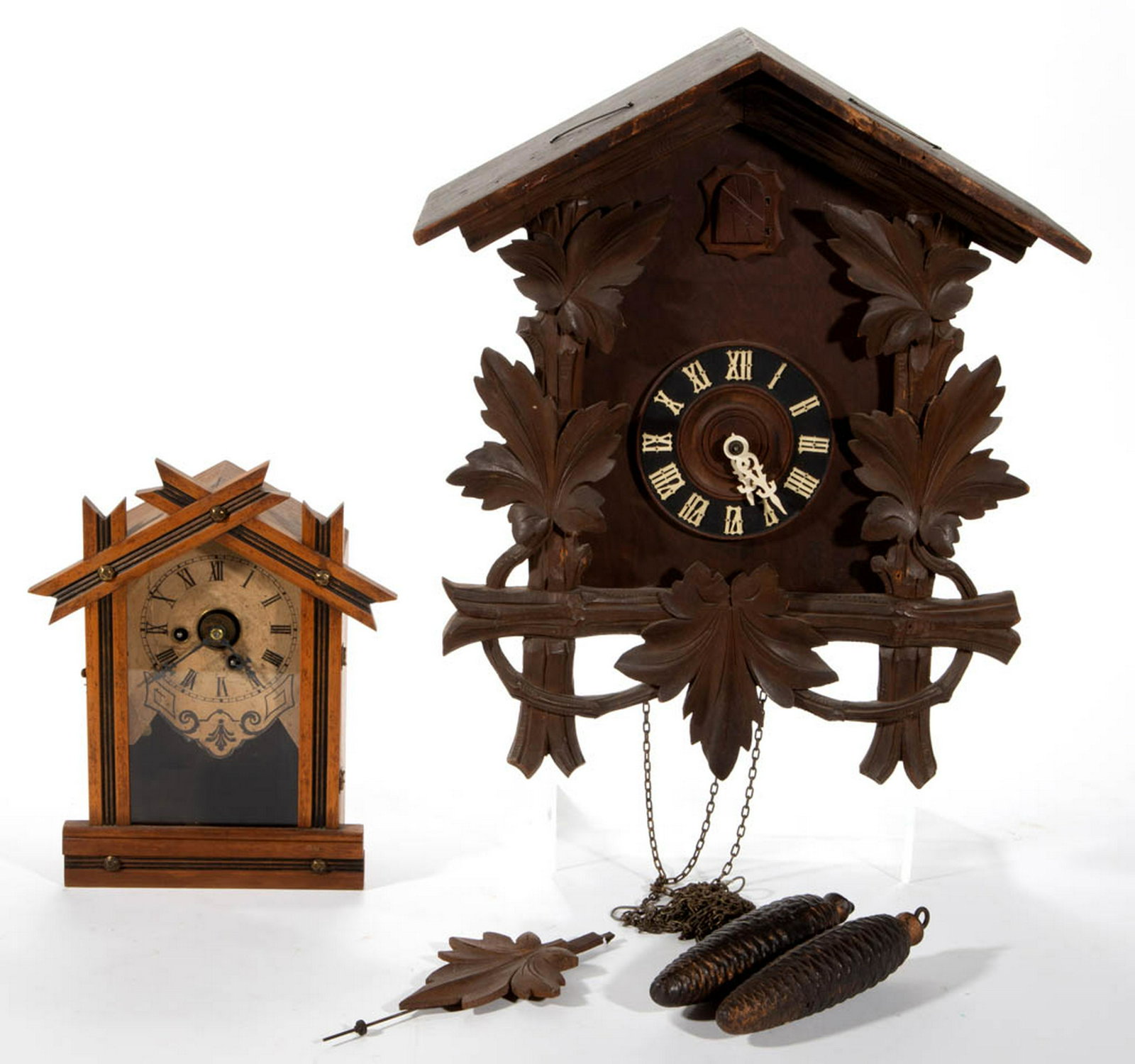 GERMAN CUCKOO CLOCK: GERMAN CUCKOO CLOCK, with carved leaves, and stamped "MADE IN GERMANY". Pendulum, and two weights. Together with an Ingraham & Co Clock, Bristol Conn, with pendulum. Two pieces total. Late 19th/first 