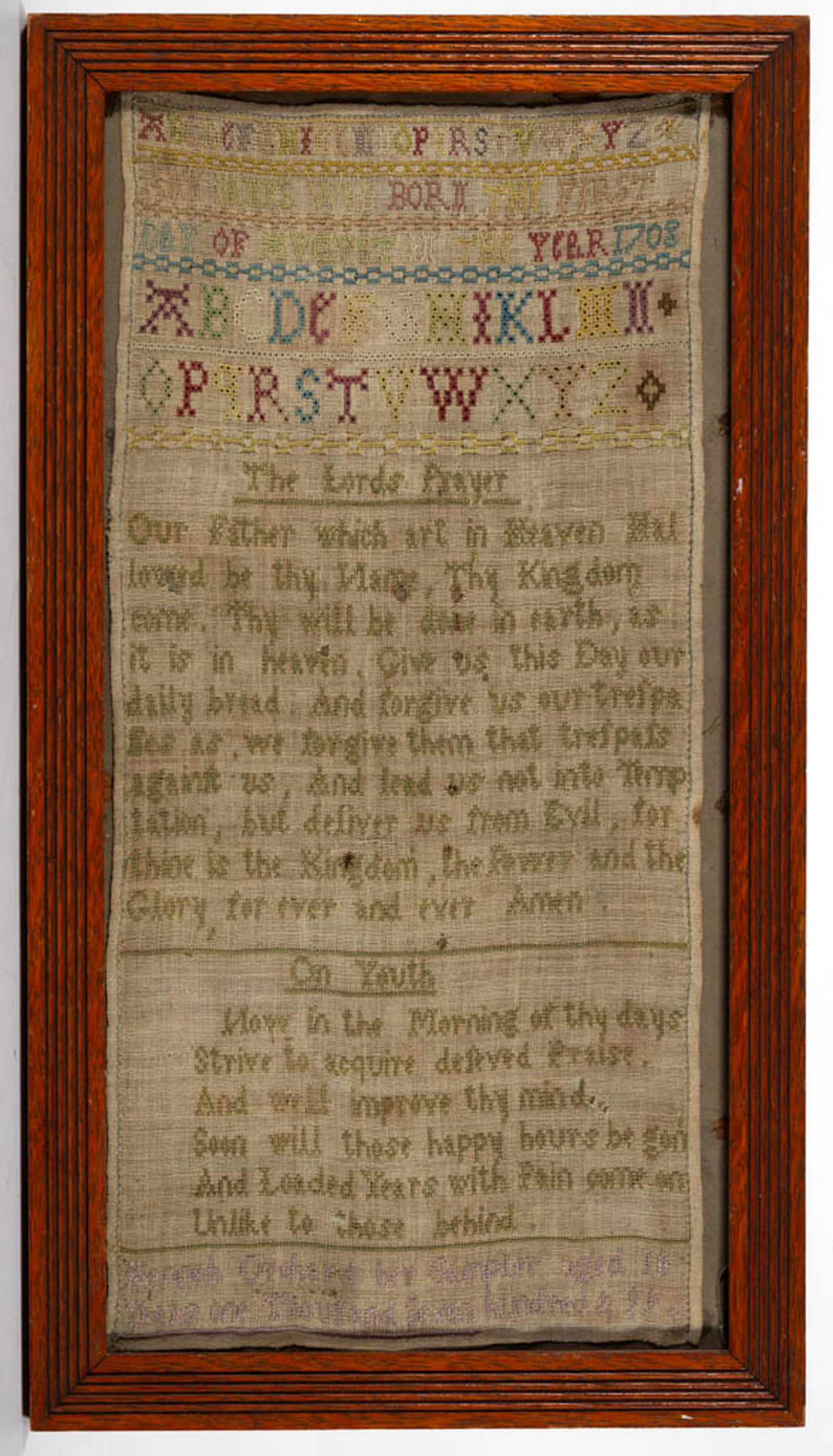 BRITISH NEEDLEWORK SAMPLER: BRITISH NEEDLEWORK SAMPLER, silk on linen, an alphabet row above "ANN [J]AMES WAS BORN THE FIRST / DAY OF AVGVST IN THE YEAR 1708" and another two alphabet rows, center with verses of "The Lords Praye