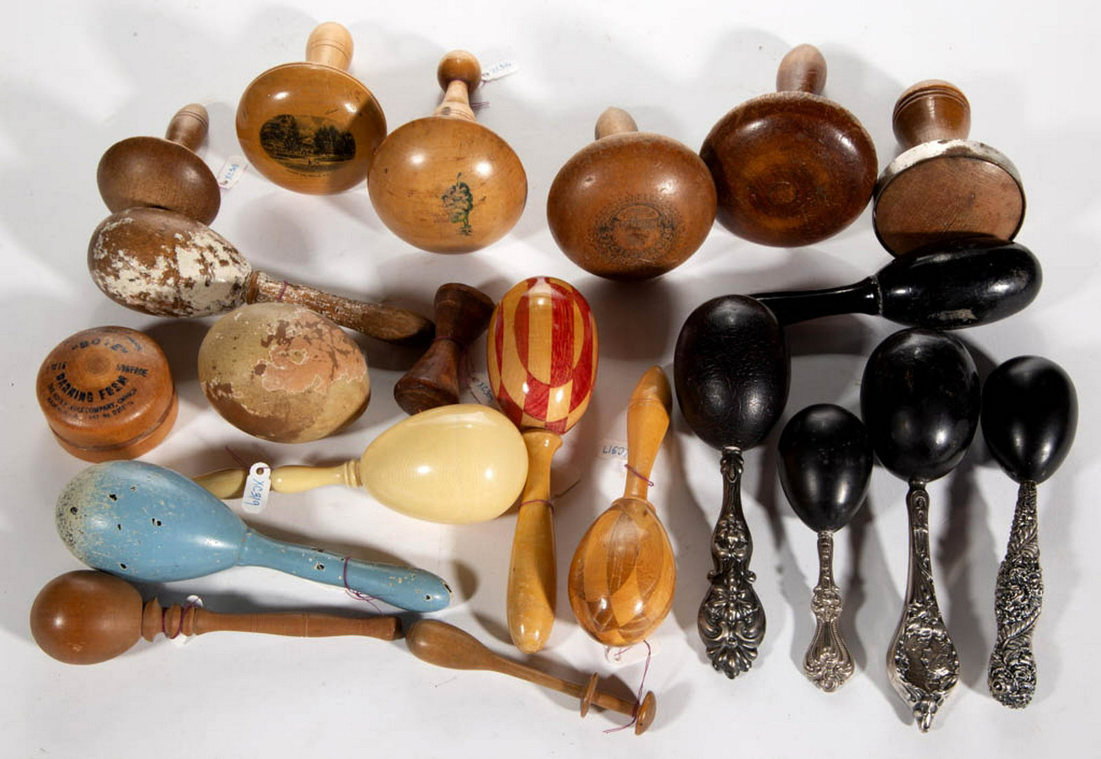 GERMAN AND OTHER SEWING DARNERS, LOT OF 21: GERMAN AND OTHER SEWING DARNERS, LOT OF 21, including three Art Nouveau-style sterling silver hollow-handled with ebonized egg examples, including a Theodore W. Foster & Bros. Co with lady, and a silv