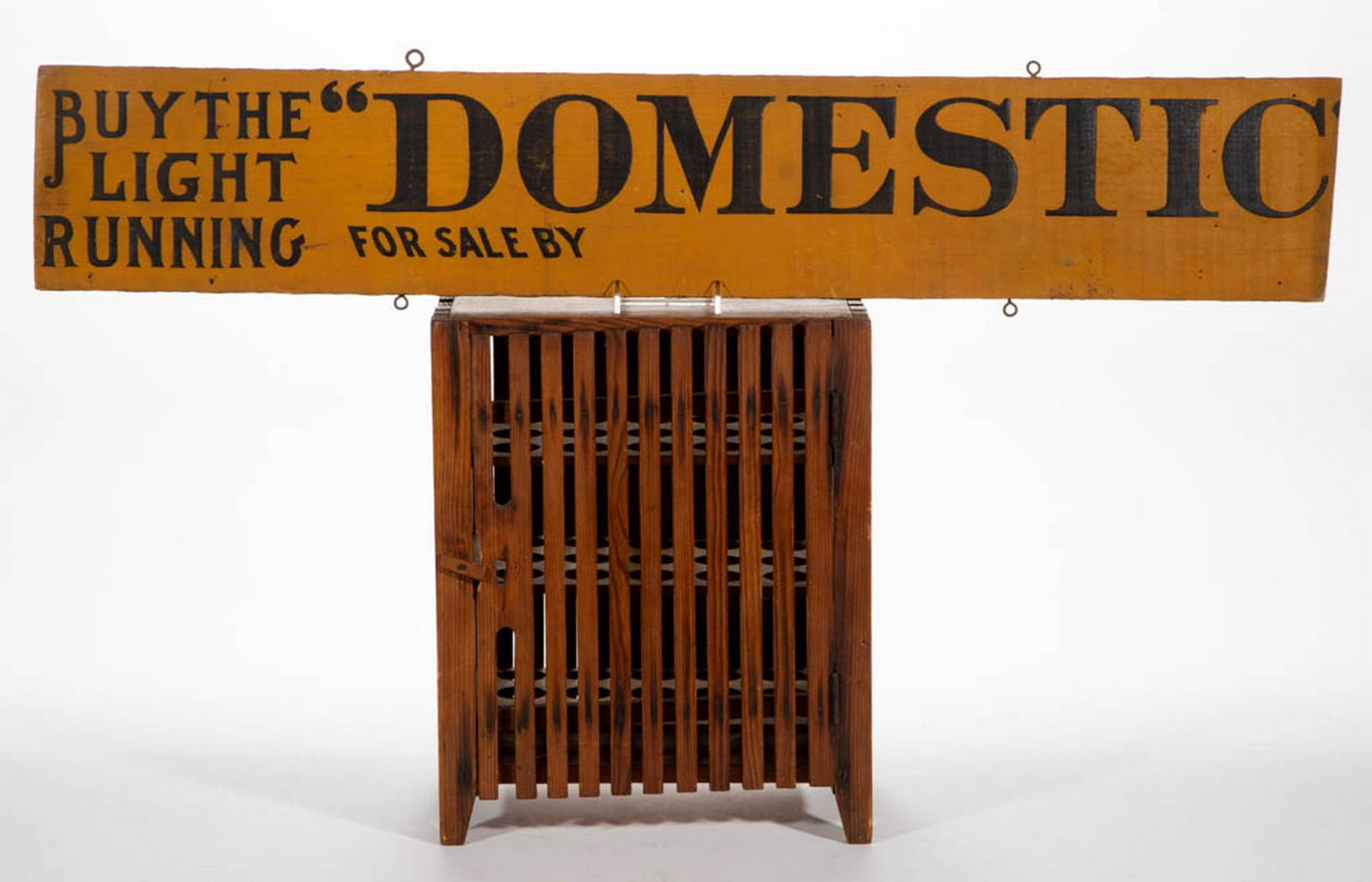 SOUTHERN YELLOW PINE EGG SAFE: SOUTHERN YELLOW PINE EGG SAFE, slated form with hinged door and removable cut-out trays. Old surface, possibly original. Together with a "DOMESTIC" painted wooden trade sign (cut down). Two pieces tot