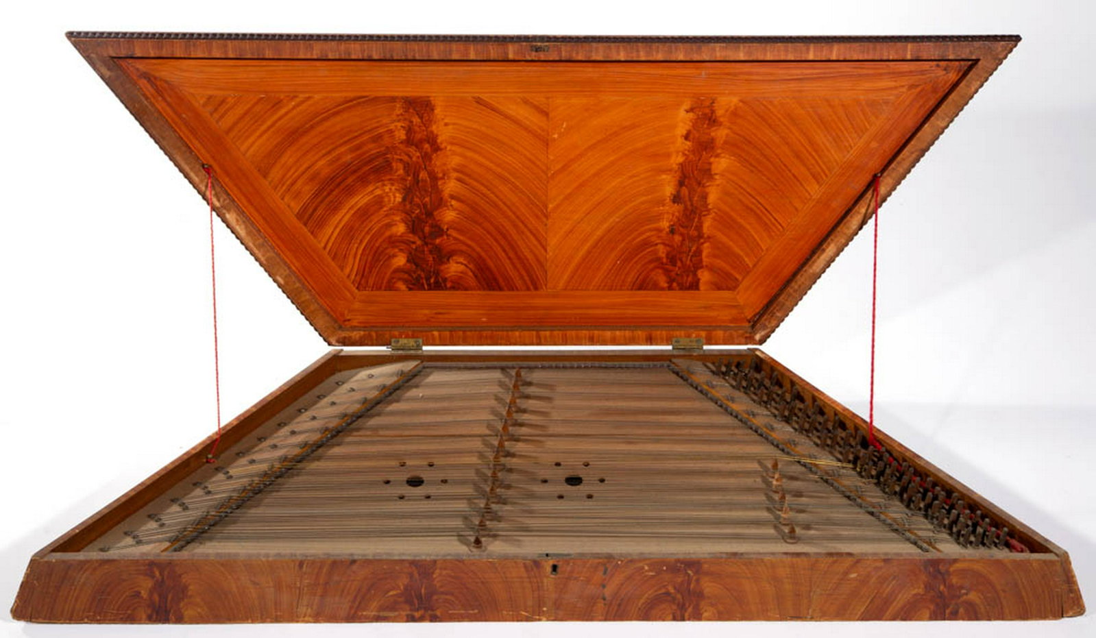 AMERICAN PAINT-DECORATED POPLAR HAMMERED DULCIMER: AMERICAN PAINT-DECORATED POPLAR HAMMERED DULCIMER, trapezoidal form with hinged lid, cut-out sounding board, original paint-decorated surface. Mid 19th century. 5" H, 44" W, 15" D. Very good condition