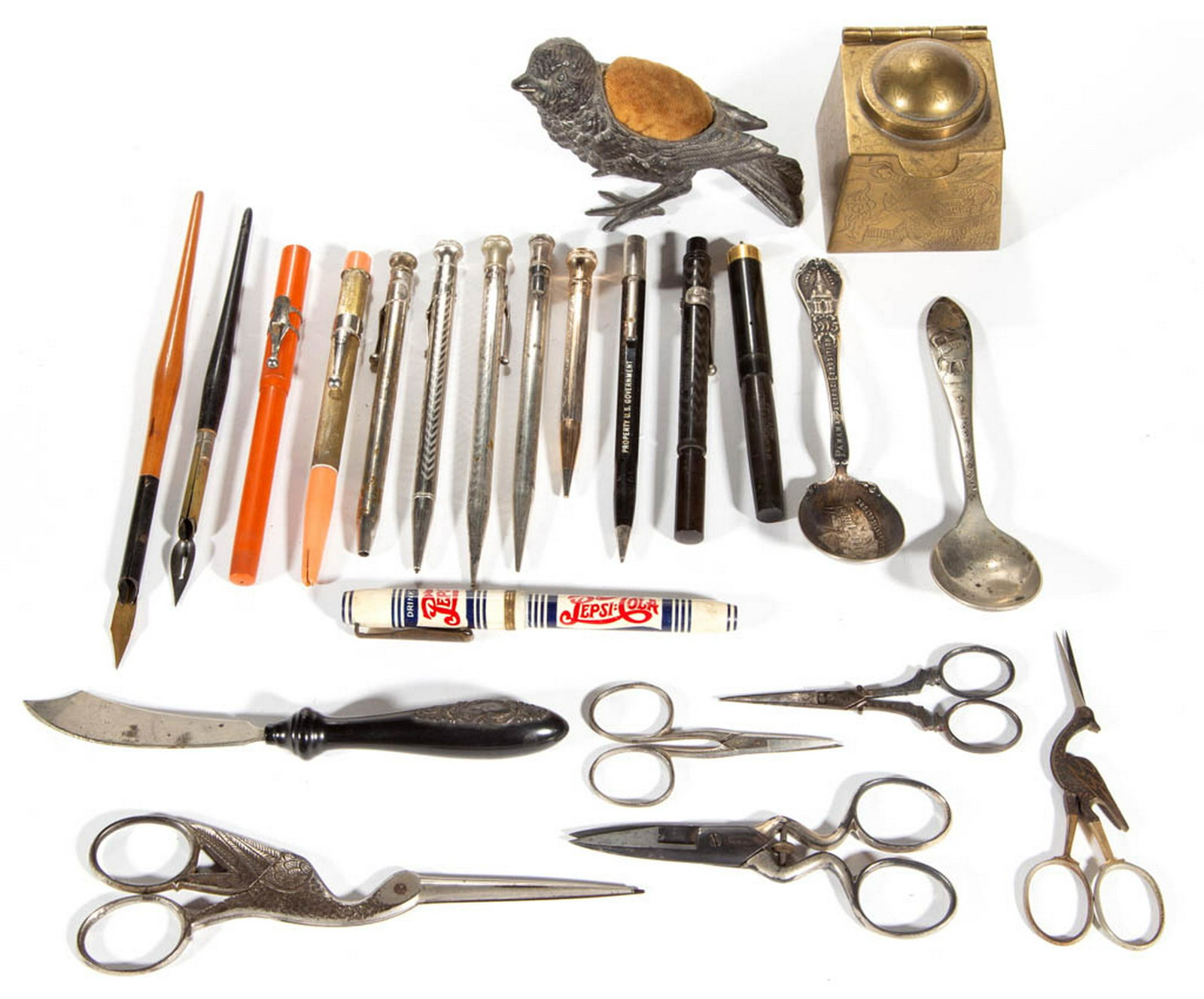 ASSORTED SEWING / WRITING ARTICLES, LOT OF 21: ASSORTED SEWING / WRITING ARTICLES, LOT OF 21, including a Pepsi Cola fountain pen, Oriental inkwell, and two figural bird scissors. Together with a Mickey Mouse and Panama-Pacific Exposition souvenir