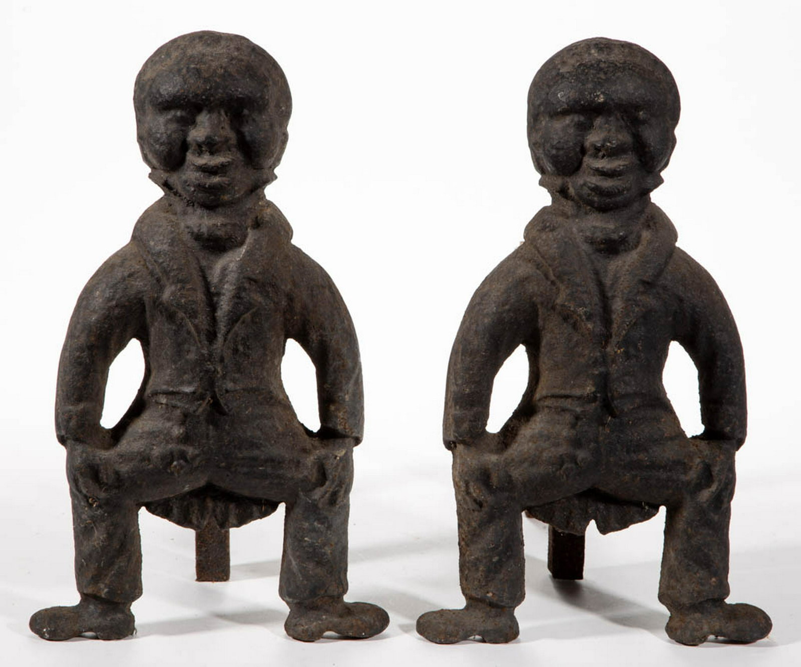 PAIR OF FOLK ART / BLACK AMERICANA FIGURAL CAST-IRON: PAIR OF FOLK ART / BLACK AMERICANA FIGURAL CAST-IRON ANDIRONS, no markings, with possibly original log supports. Probably 19th century. 16 1/2" H, 18" D. Good overall condition, moderate to heavy area