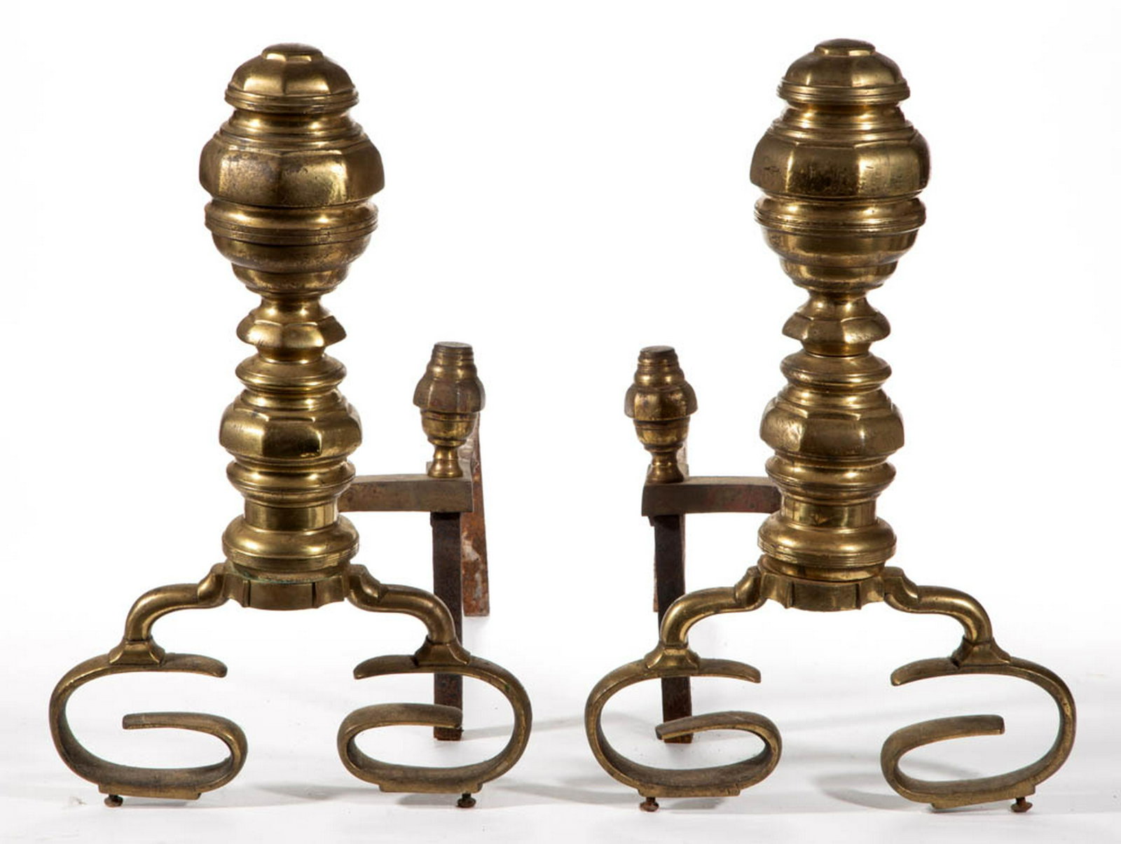 AMERICAN EMPIRE BRASS PAIR OF ANDIRONS: AMERICAN EMPIRE BRASS PAIR OF ANDIRONS, a large example, ring turned finial and shaft, raised on scrolled legs, original iron log supports and brass log stops. First half 19th century. 19" HOA, 21 1/4
