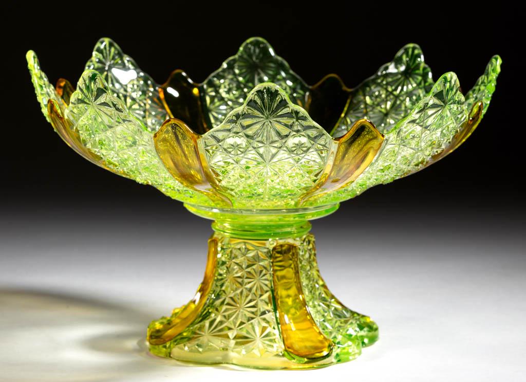 DUNCAN ELLROSE (OMN) / AMBERETTE (OMN) - AMBER-STAINED: DUNCAN ELLROSE (OMN) / AMBERETTE (OMN) - AMBER-STAINED OPEN COMPOTE, Vaseline (reacts under black light), flared bowl on a square base. Geo. Duncan & Sons. Pattern introduced in 1885. 7" H, 11" DOA ri