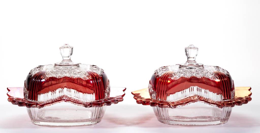 FASHION / DAISY AND BUTTON WITH RED DOTS - RUBY-STAINED: FASHION / DAISY AND BUTTON WITH RED DOTS - RUBY-STAINED COVERED BUTTER DISHES, LOT OF TWO, colorless. Bryce Bros. or George Duncan & Sons. 1888-1900. 5" HOA, 8" DOA.Each having scattered flaking/chipp