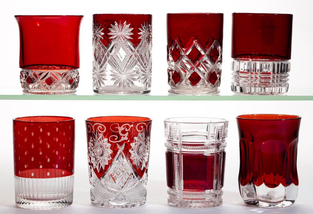 ASSORTED EAPG - RUBY-STAINED TUMBLERS, LOT OF EIGHT: ASSORTED EAPG - RUBY-STAINED TUMBLERS, LOT OF EIGHT, colorless, including a Shoshone, a Zippered Block, a Hero, and a Co-Op Block example. Various makers. Fourth quarter 19th/first quarter 20th centur