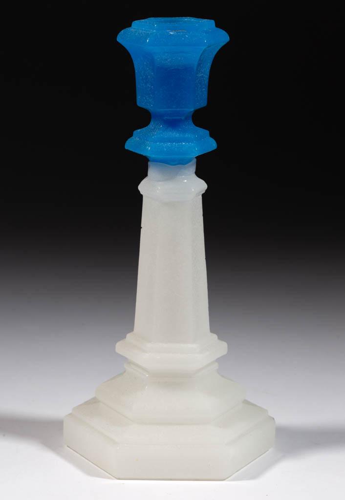 PRESSED HEXAGONAL CANDLESTICK: PRESSED HEXAGONAL CANDLESTICK, translucent starch blue above alabaster/clambroth with a lightly sanded surface, standard size, urn-form socket with a bladed-knop extension, raised on a tapered standar