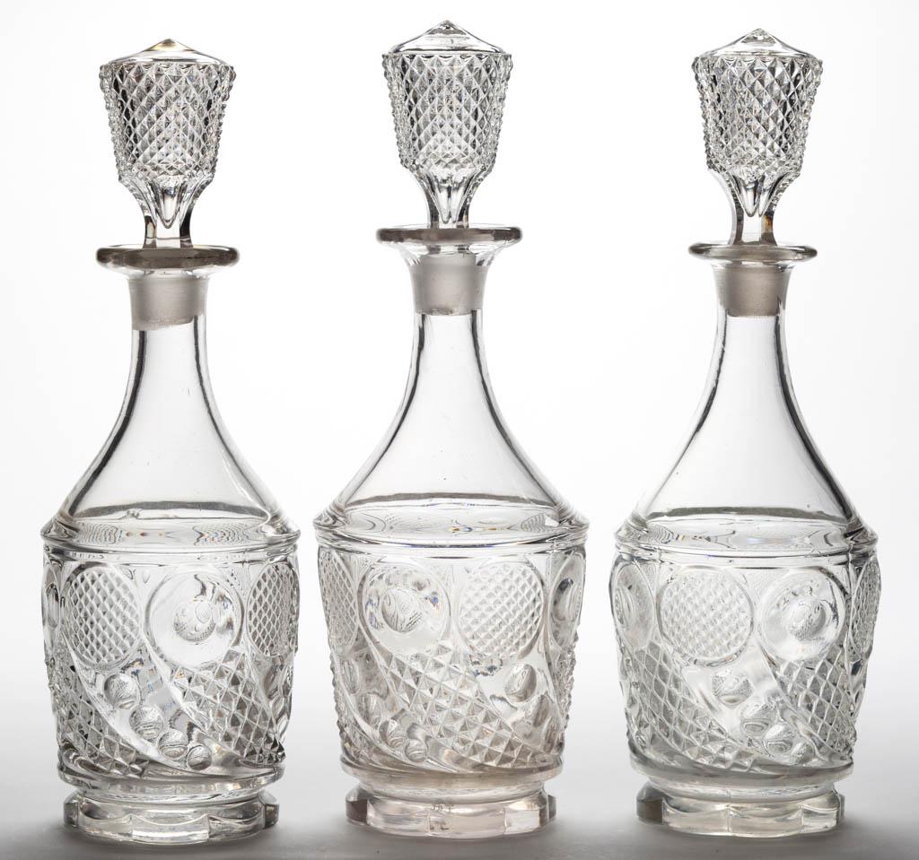 HORN OF PLENTY / COMET (OMN) QUART DECANTERS, LOT OF: HORN OF PLENTY / COMET (OMN) QUART DECANTERS, LOT OF THREE, colorless lead glass, each with scalloped foot having polished pontil mark, original Diamond Point stoppers. One with gilt decoration to top