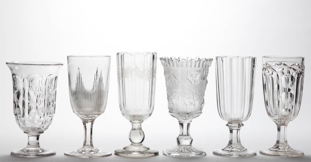ASSORTED FLINT EAPG CELERY VASES, LOT OF SIX: ASSORTED FLINT EAPG CELERY VASES, LOT OF SIX, colorless lead glass, including Sandwich Ivy, Washington, Blaze, and Punty, Quatrefoil, and Waffle. Various makers. Third quarter 19th century.7 3/4" to 8