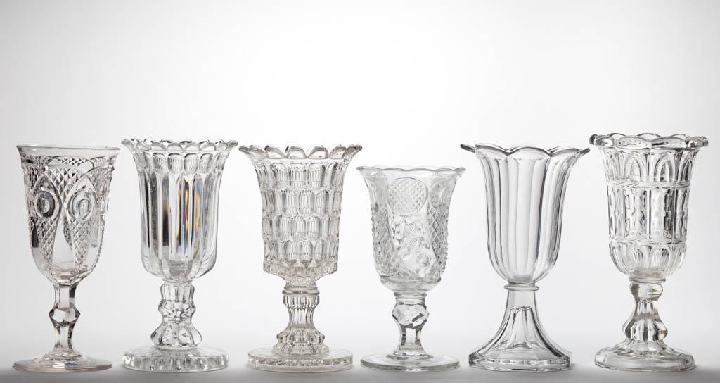 ASSORTED FLINT EAPG CELERY VASES, LOT OF SIX: ASSORTED FLINT EAPG CELERY VASES, LOT OF SIX, colorless lead glass, including a Giant Prism with Thumbprint Band, a Horn of Plenty, and a Bull's Eye with Diamond Point. Various makers. Third quarter 1