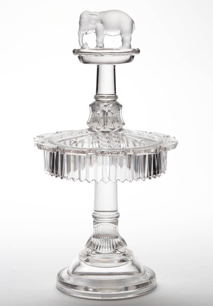 JUMBO SPOON RACK: JUMBO SPOON RACK, colorless, lightly frosted finial with a plain ground, embossed under the base, "PAT SEPT 23 1884". Canton Glass Co. Circa 1884.11 1/4" HOA, 5 3/4" DOA. Excellent condition, tabs wit