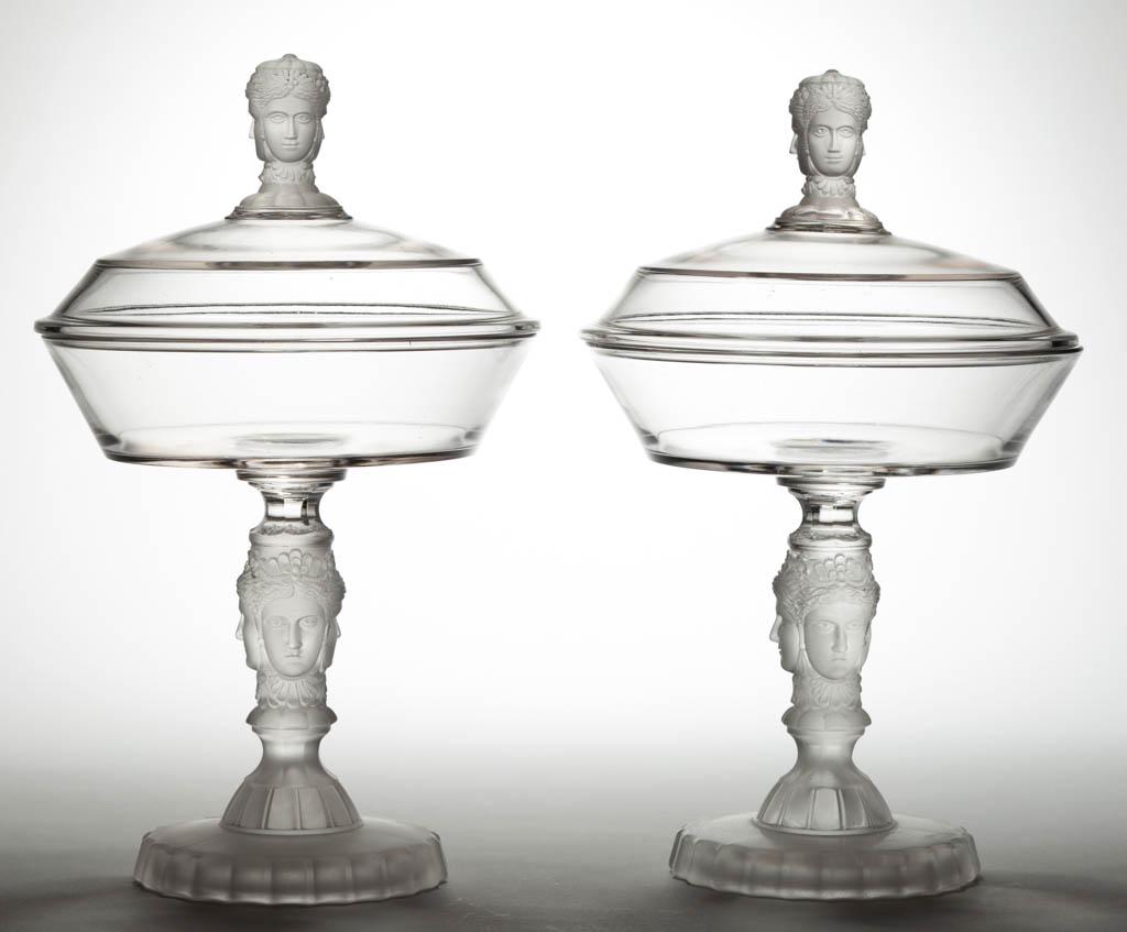 THREE FACE / DUNCAN NO. 400 (OMN) PAIR OF COVERED: THREE FACE / DUNCAN NO. 400 (OMN) PAIR OF COVERED COMPOTES, colorless and frosted, each on a high standard. Geo. Duncan & Sons, Pittsburgh, PA. 1878-1886.12" and 12 1/4" HOA, 7 1/4" D rims. Each in ve