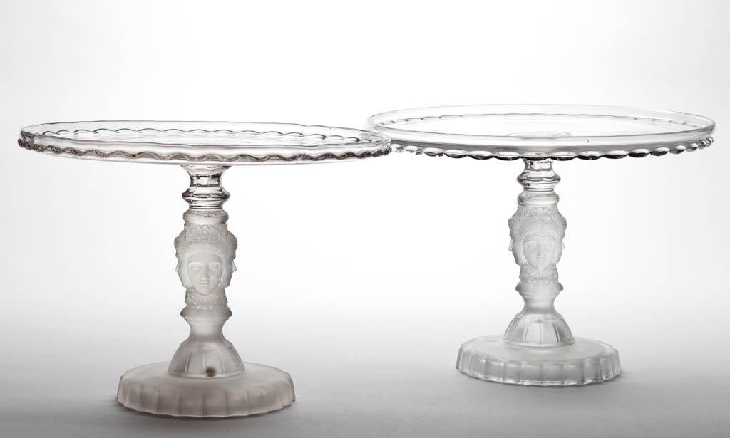 THREE FACE / DUNCAN NO. 400 (OMN) SALVER / CAKE STANDS,: THREE FACE / DUNCAN NO. 400 (OMN) SALVER / CAKE STANDS, LOT OF TWO, colorless and frosted. Geo. Duncan & Sons, Pittsburgh, PA. 1878-1886.8" and 8 1/4" H, 11" D rims. One undamaged; other with a small 