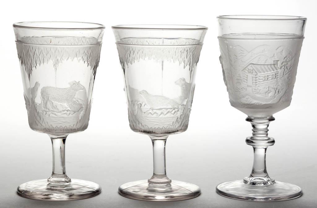 ASSORTED EAPG GOBLETS, LOT OF THREE: ASSORTED EAPG GOBLETS, LOT OF THREE, colorless and frosted, comprising two Polar Bear and one Westward Ho/Pioneer (OMN). Fourth quarter 19th century.6 1/8" to 6 1/2" H. Undamaged. Provenance: From the