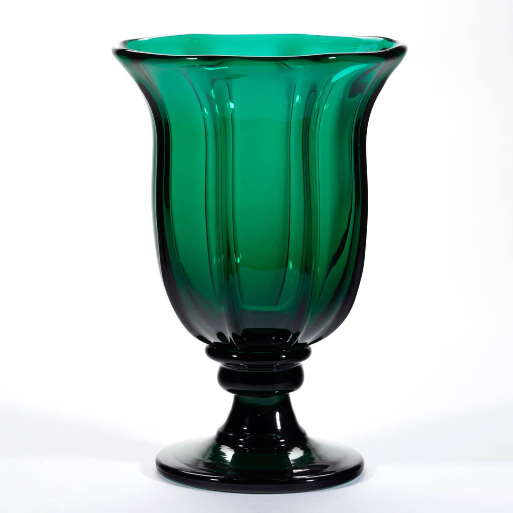 STUDIO PILLAR-MOLDED LARGE VASE: STUDIO PILLAR-MOLDED LARGE VASE, brilliant emerald green, deep bowl with eight ribs, raised on a compressed knop, short stem, and thick foot with rough pontil mark. Sand-blasted "M" within pontil mark