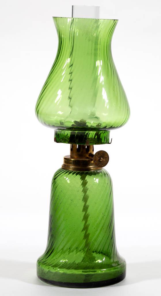 FINE RIB SWIRL MINIATURE LAMP: FINE RIB SWIRL MINIATURE LAMP, olive green, bell-form font with skirted base, matching patterned baluster-form shade, period collar. Fitted with a period burner, colorless chimney. Late 19th/early 20t
