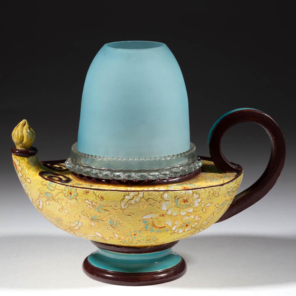 SATIN GLASS AND CERAMIC FAIRY LAMP: SATIN GLASS AND CERAMIC FAIRY LAMP, blue, fairy-size dome fitted into a colorless "S. CLARKE" lamp cup and colorless "S. CLARKE" candle cup, ceramic figural genie lamp base with several stamps to the 