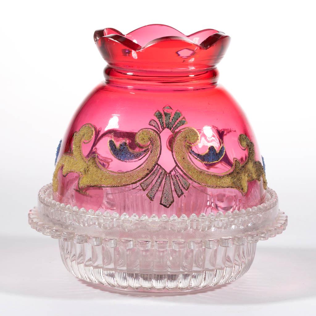 CORALENE DECORATED GLASS FAIRY LAMP: CORALENE DECORATED GLASS FAIRY LAMP, cranberry with polychrome decoration, domed shade with a scalloped crown and scrolling decoration, fitted into a colorless large lamp cup and a colorless "PRICE'S 